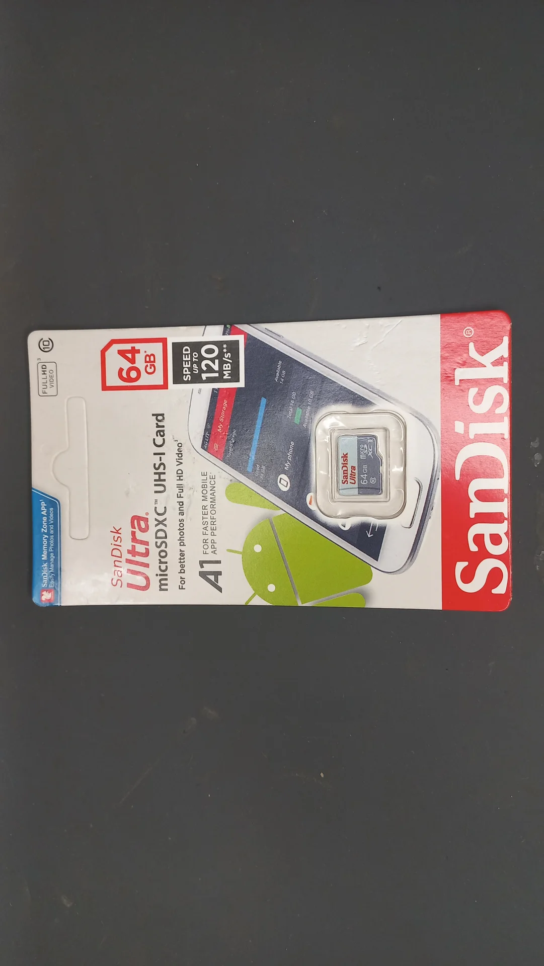 SanDisk 64 GB microSD card still in its packaging, the storage medium for the Pi's operating system