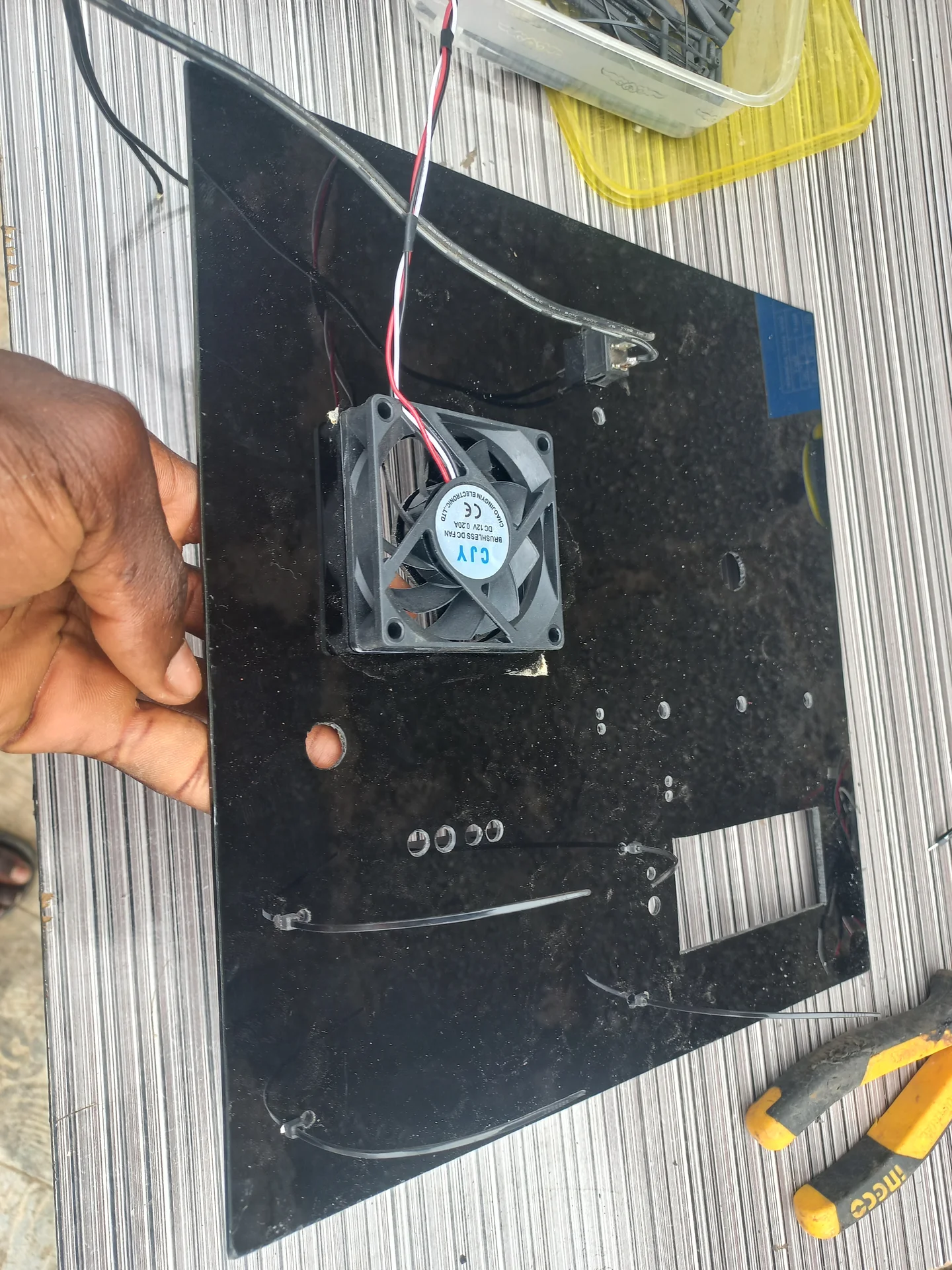 Back side of the completed panel showing the cooling fan mounted and the wiring running from each component