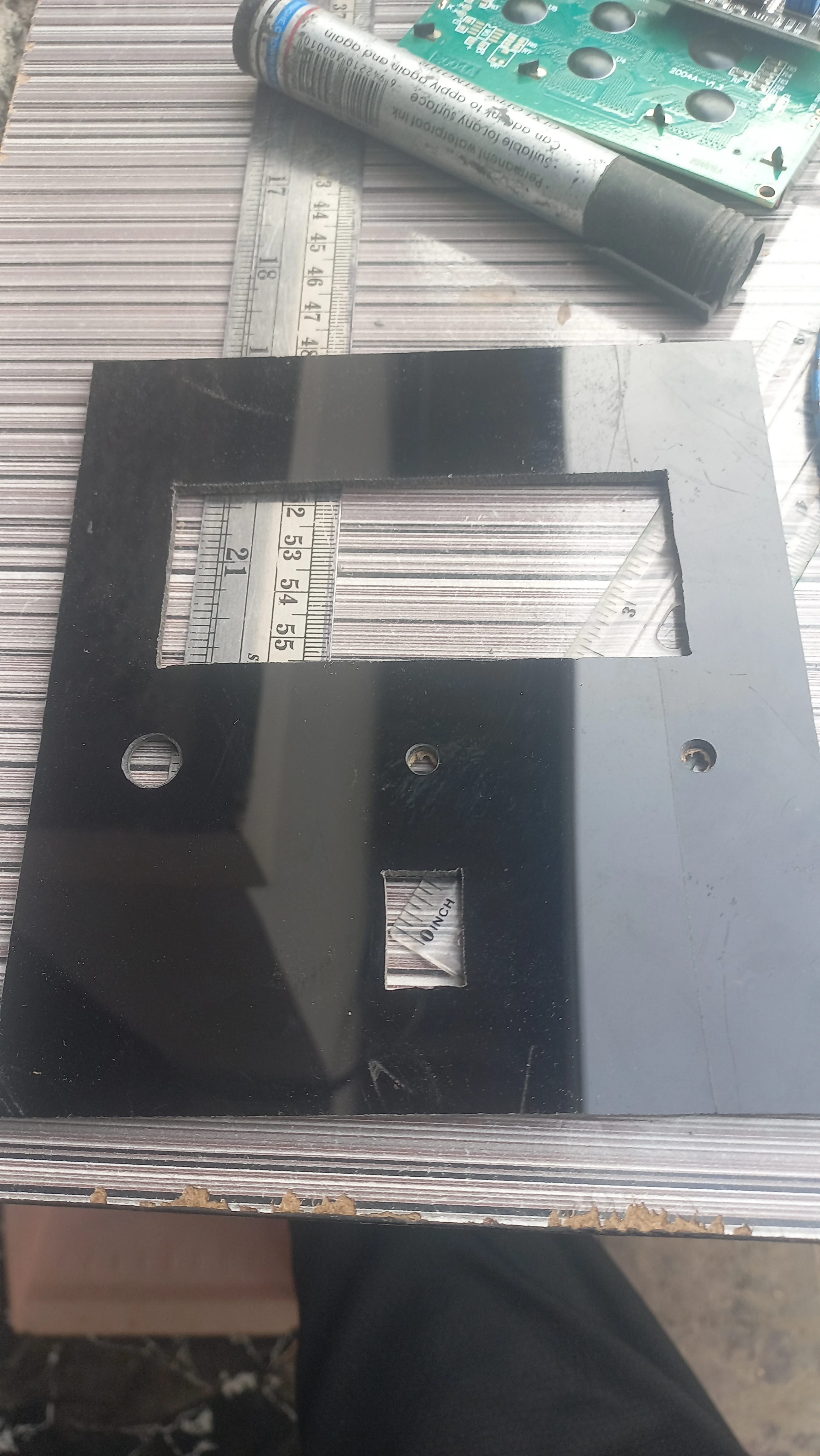 Control panel board with cutouts for switches and ports