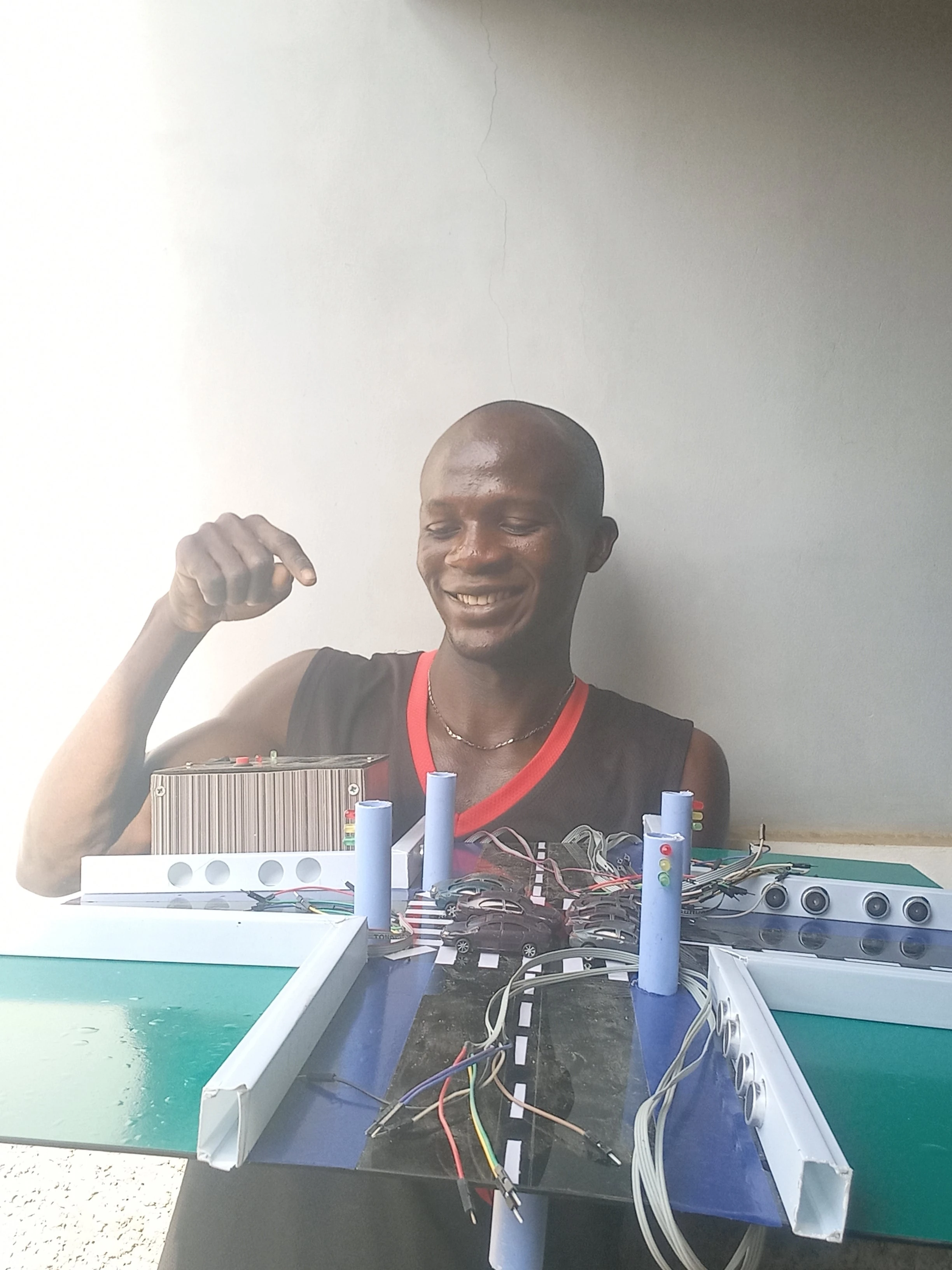 Developer Jemimah Thompson with fully wired traffic signal system — photo 1