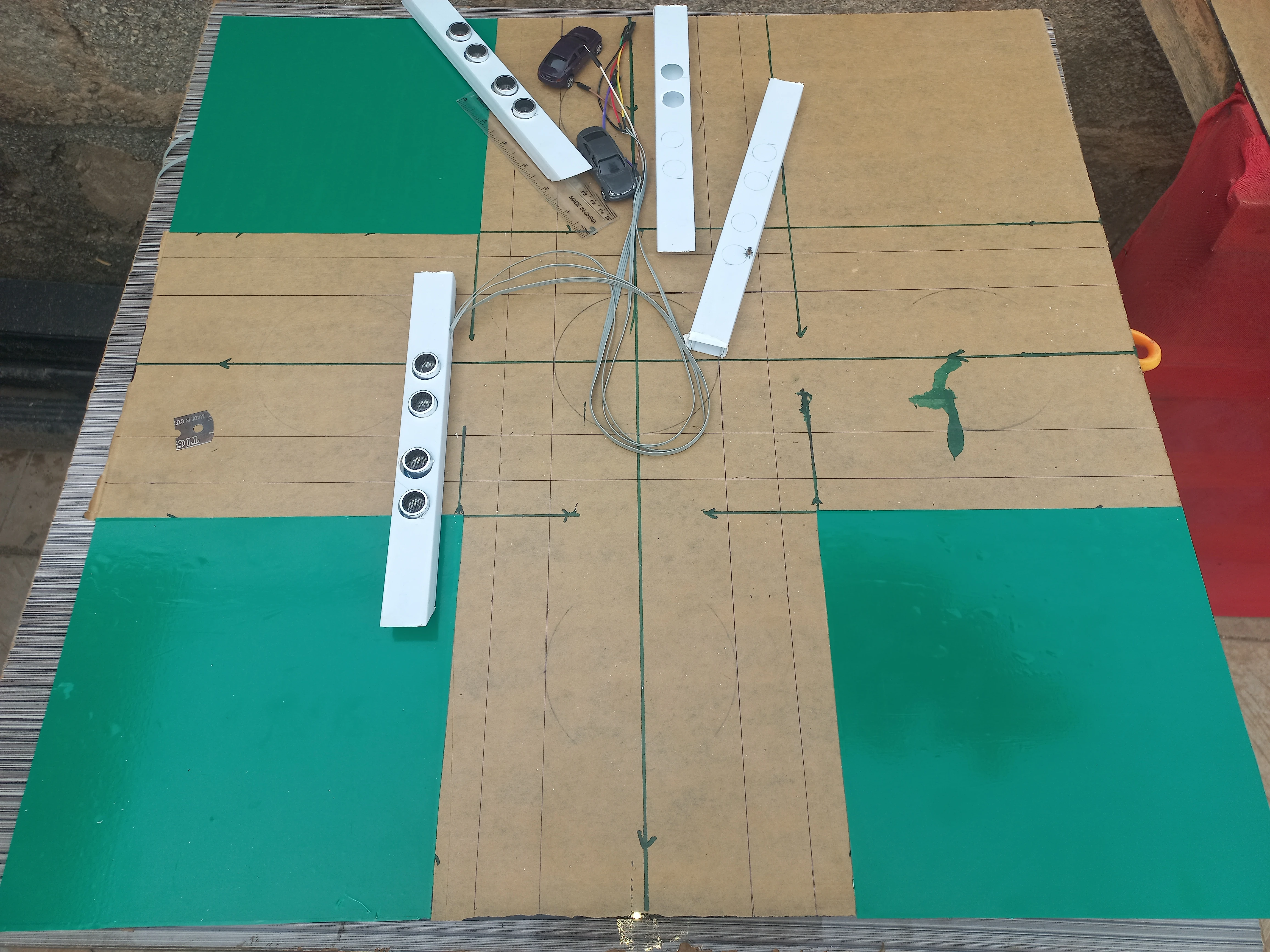 Green panels and sensor bars fitted showing 4-lane cross intersection