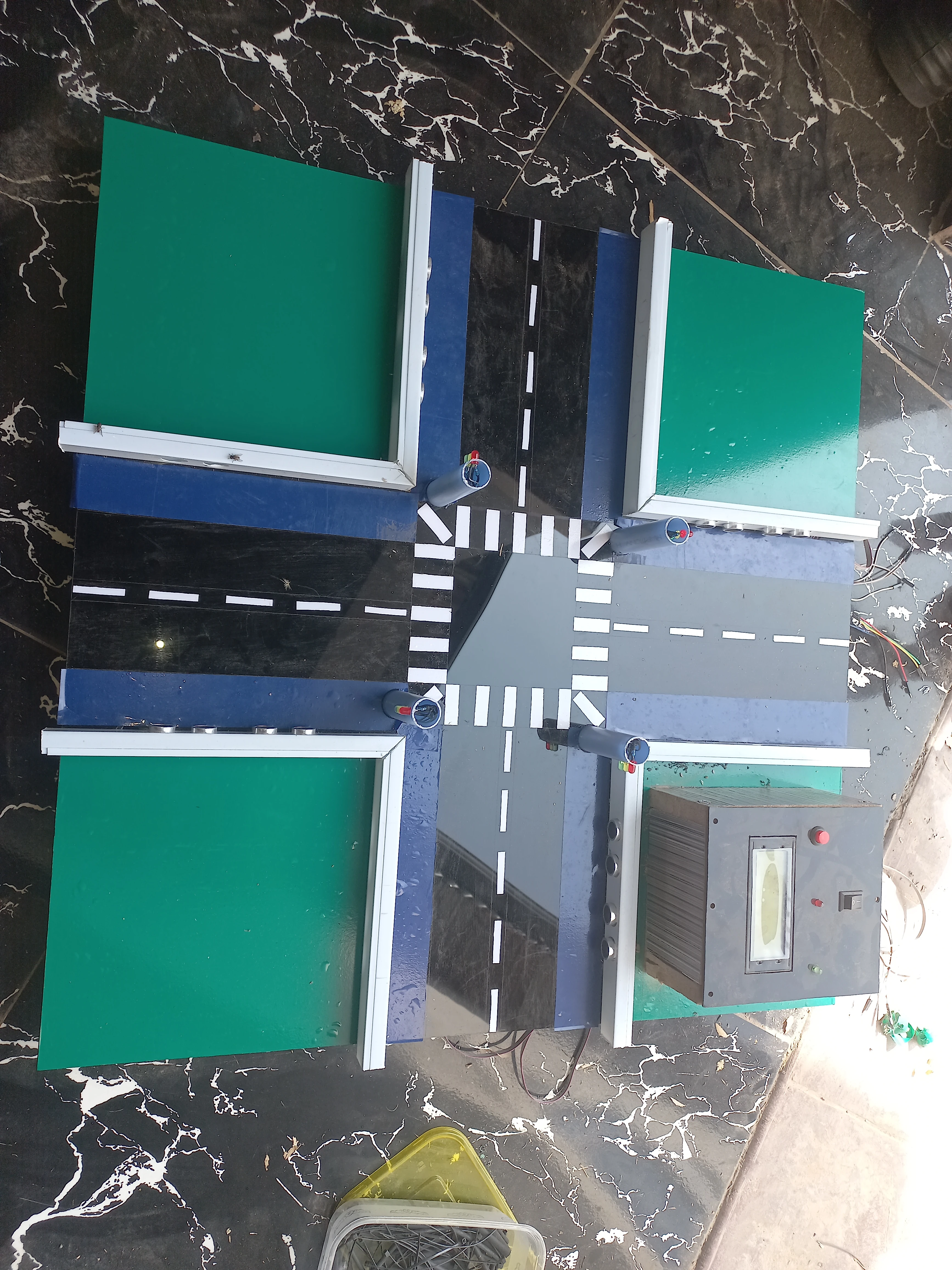 Overhead view of model with control box and wiring — angle 1