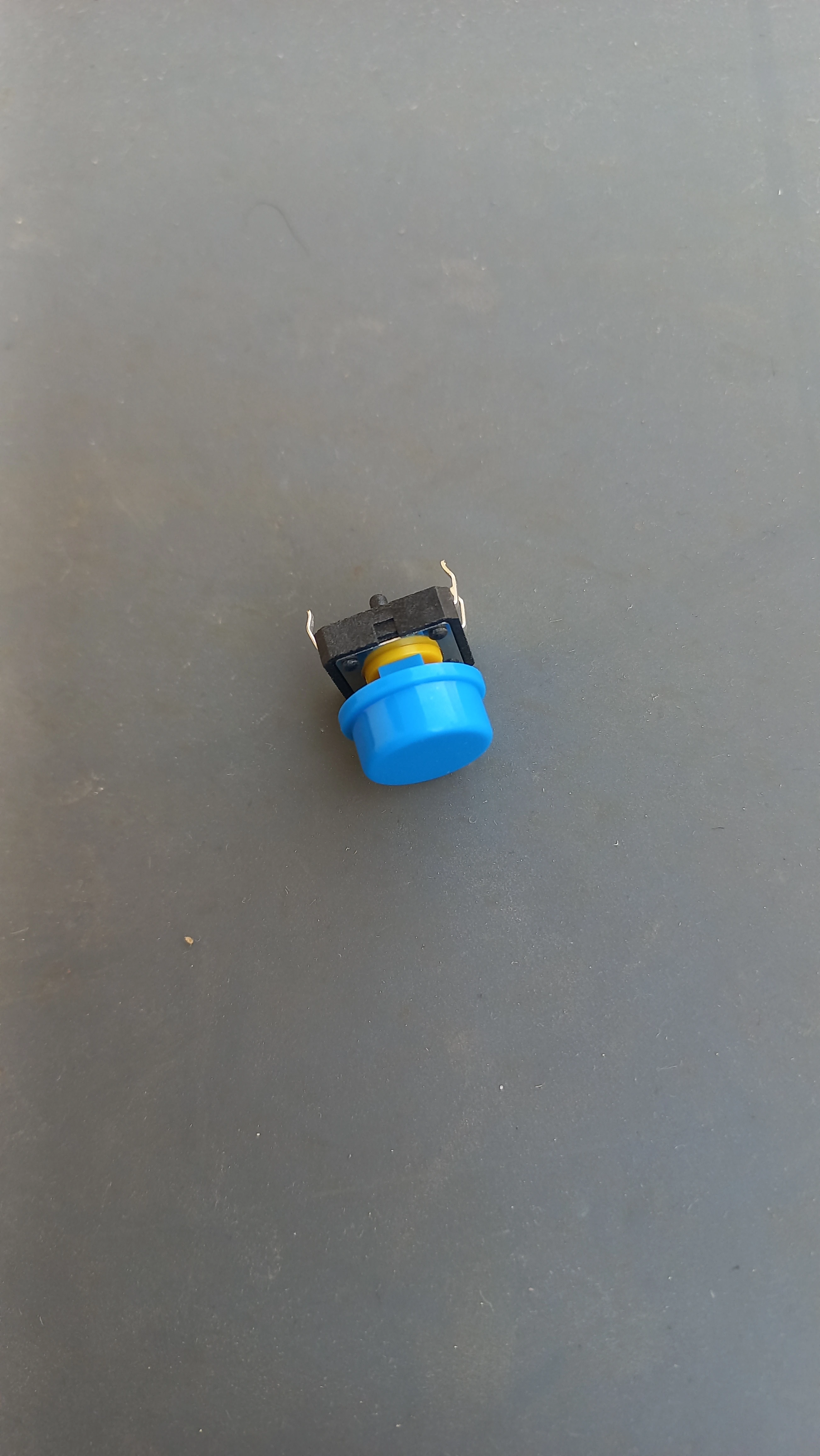 Tactile push button for emergency override — side view