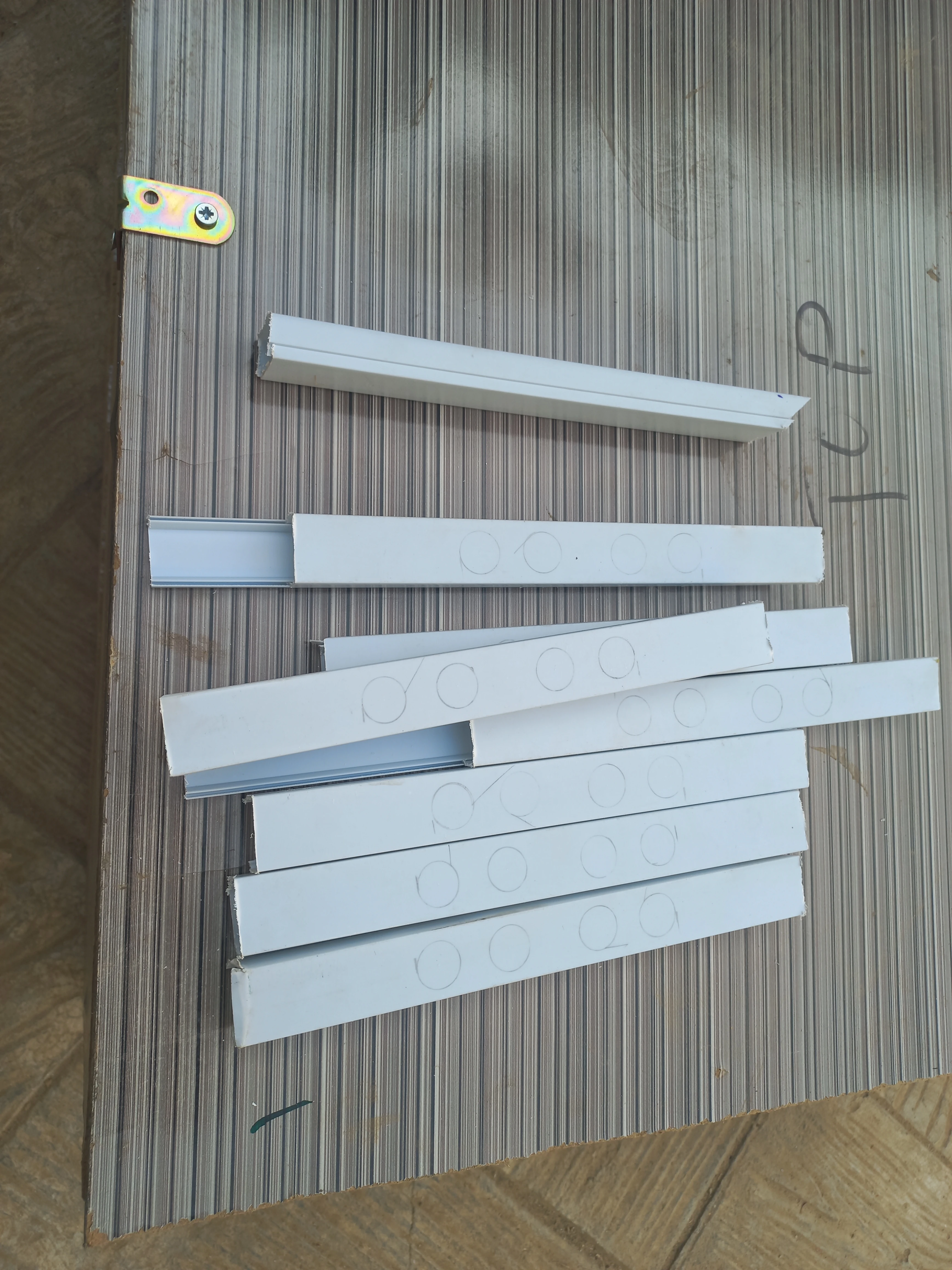 Stack of cable trunking strips cut to road-lane dimensions