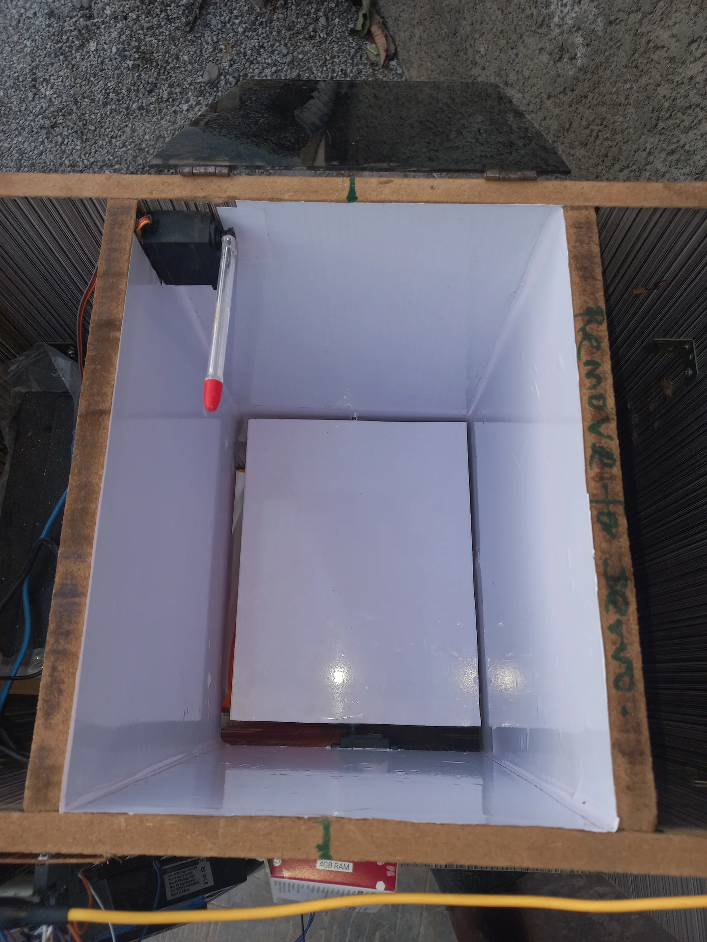 Interior of the bin with white reflective lining applied to all inner walls, improving the camera lighting