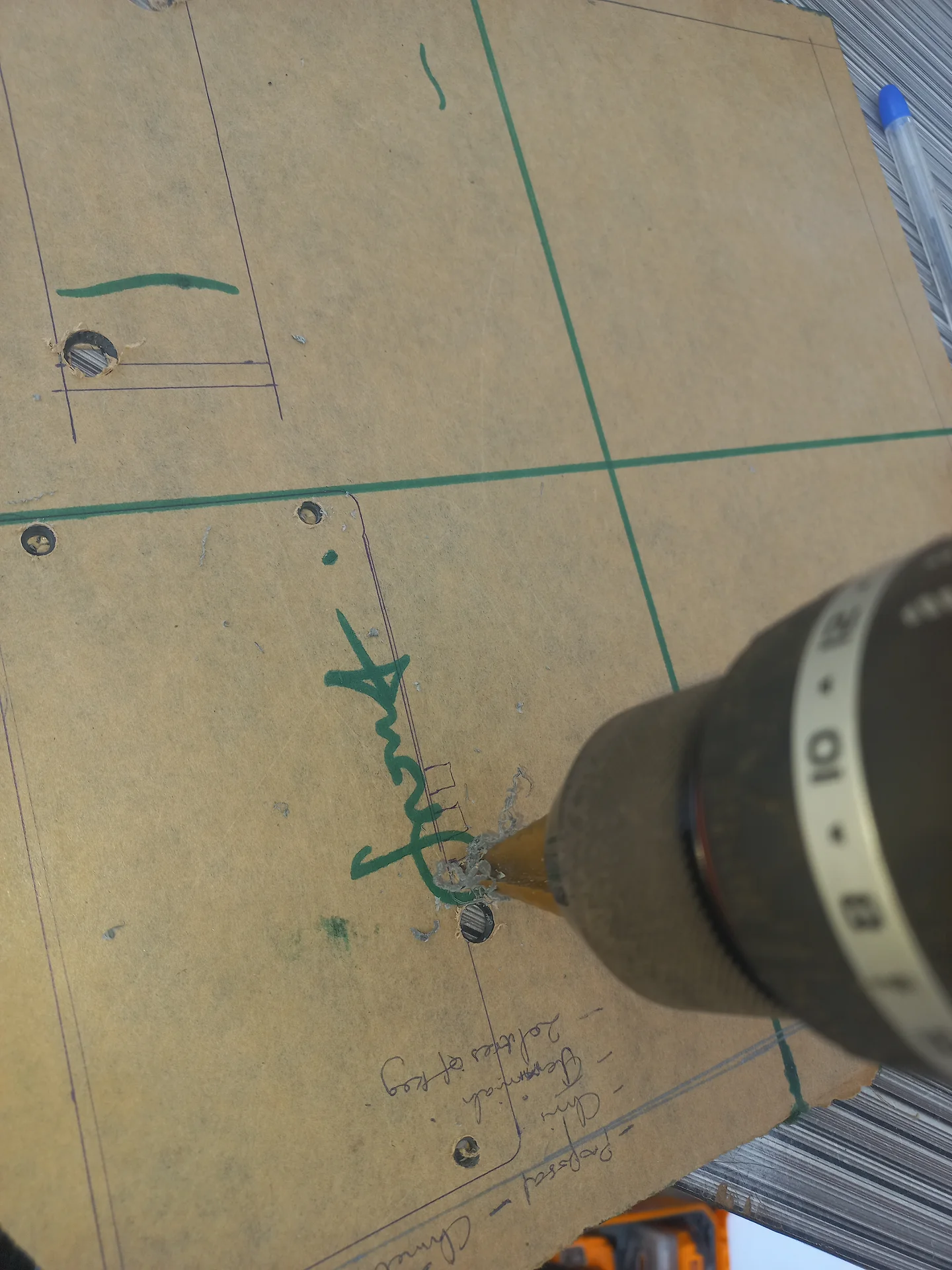 Drilling holes into the panel board for the LCD, LEDs and button cutouts
