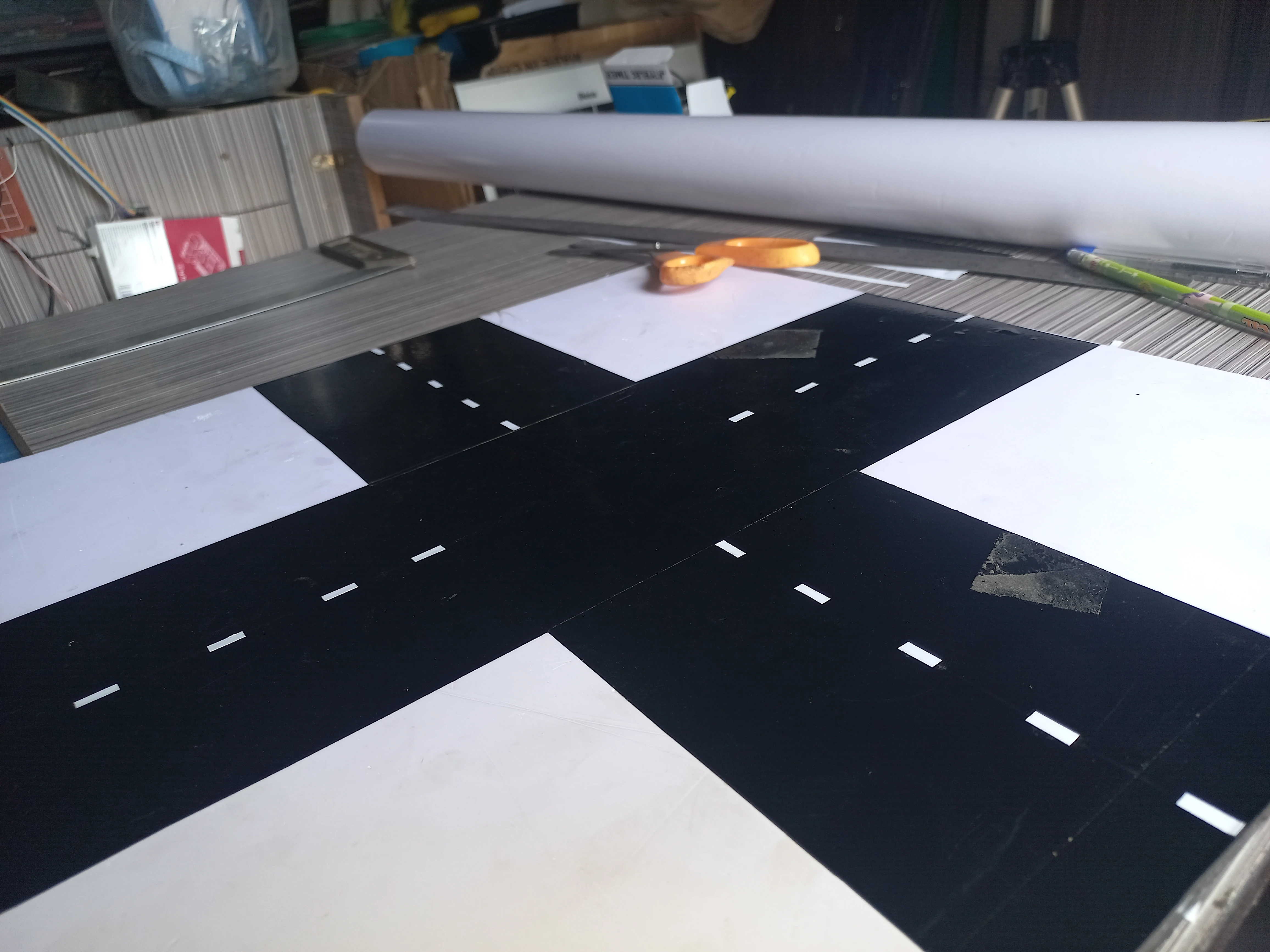 All four crossroads arms complete with dashed white centre-line markings