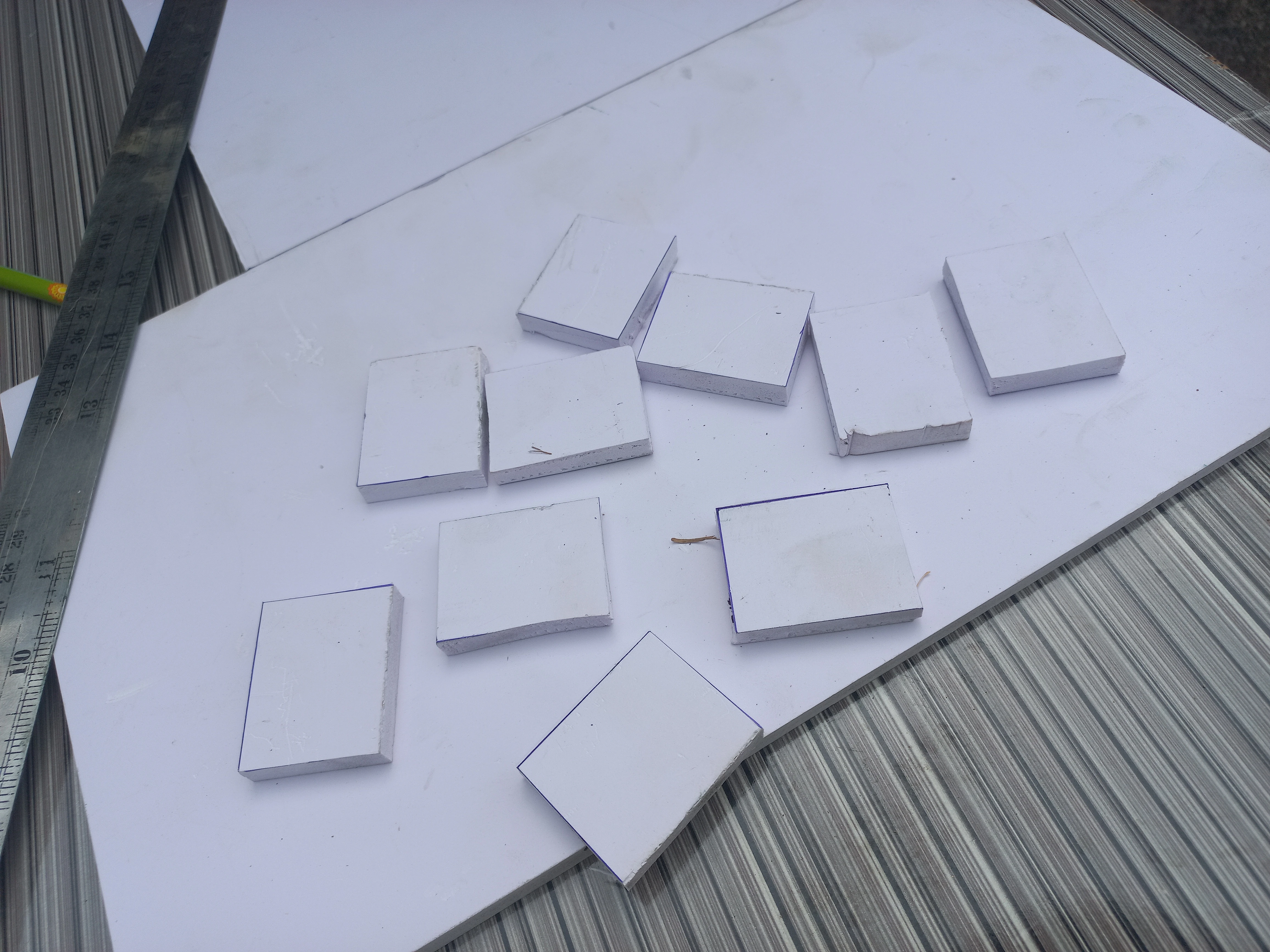 Foam tiles cut into uniform squares to form the road model surface layer