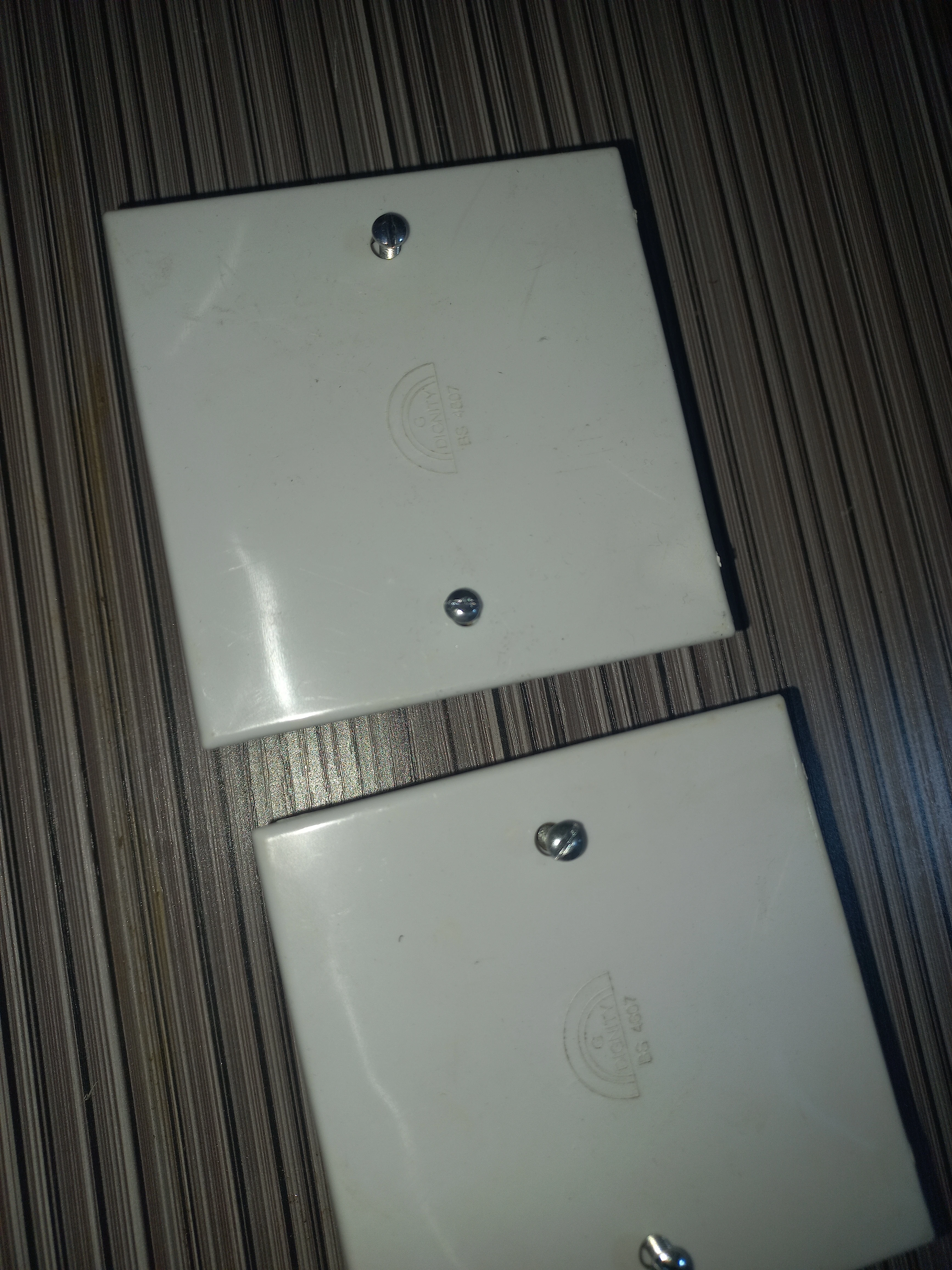 Two white PVC electrical junction box cover plates selected as enclosures for both units