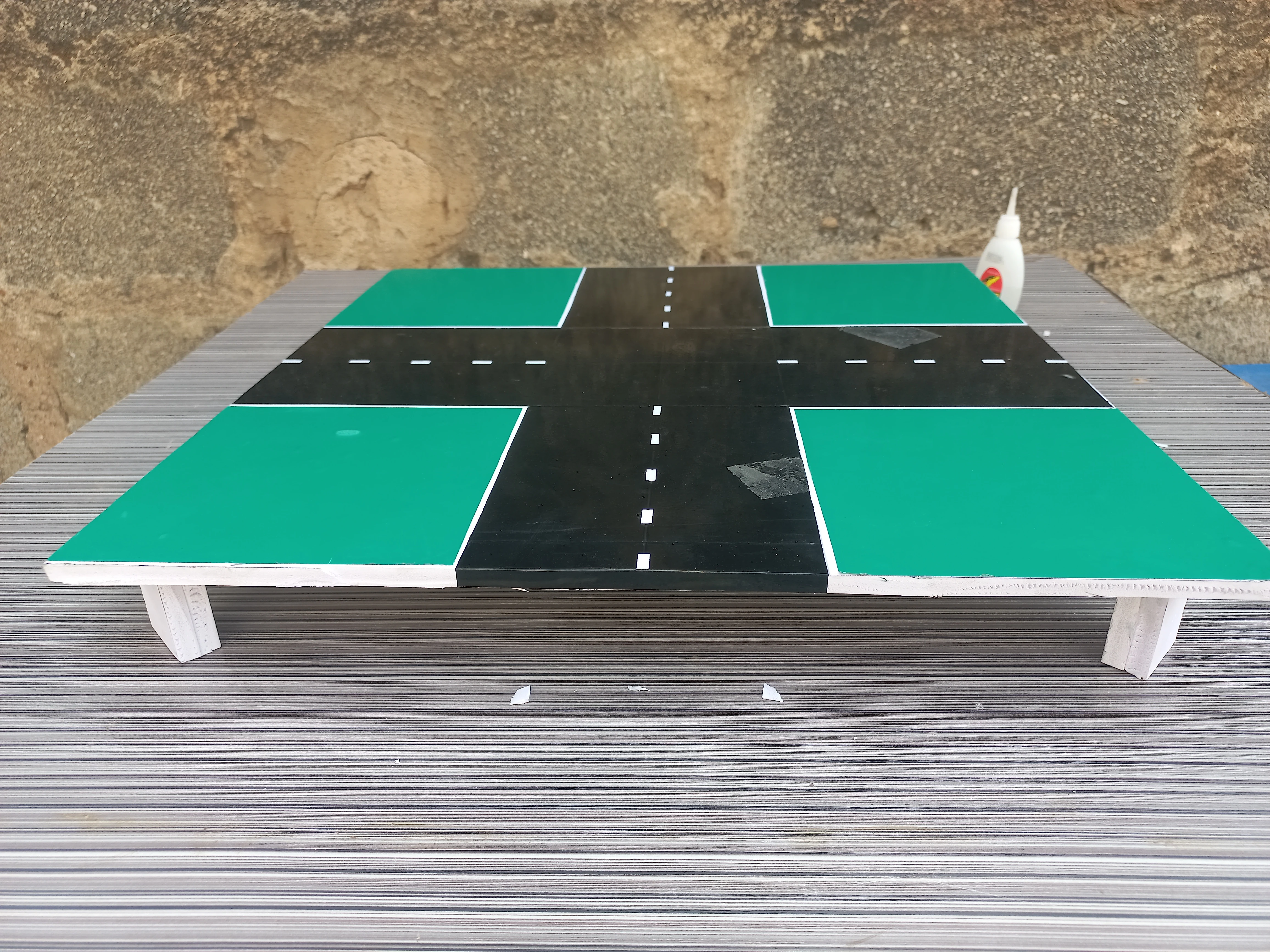 Road model elevated on its wooden leg blocks: full base structure assembled and standing