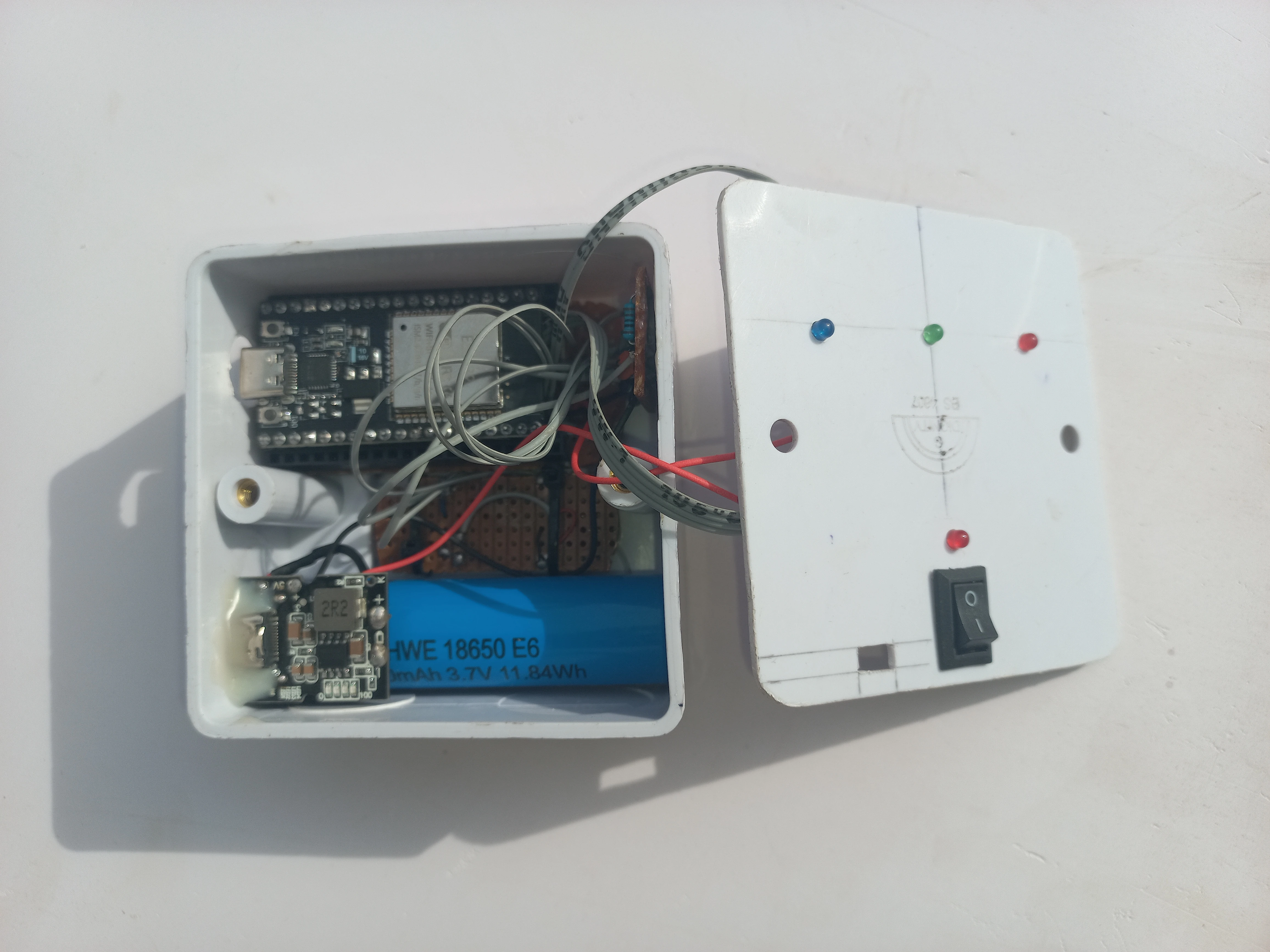 Wearable unit with front panel positioned, showing the LED cutout holes in the enclosure lid